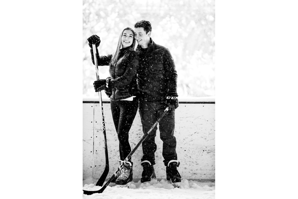 hockey-couple-embrace-on-ice-during-Bogert-Park-Snowstorm-Portraits
