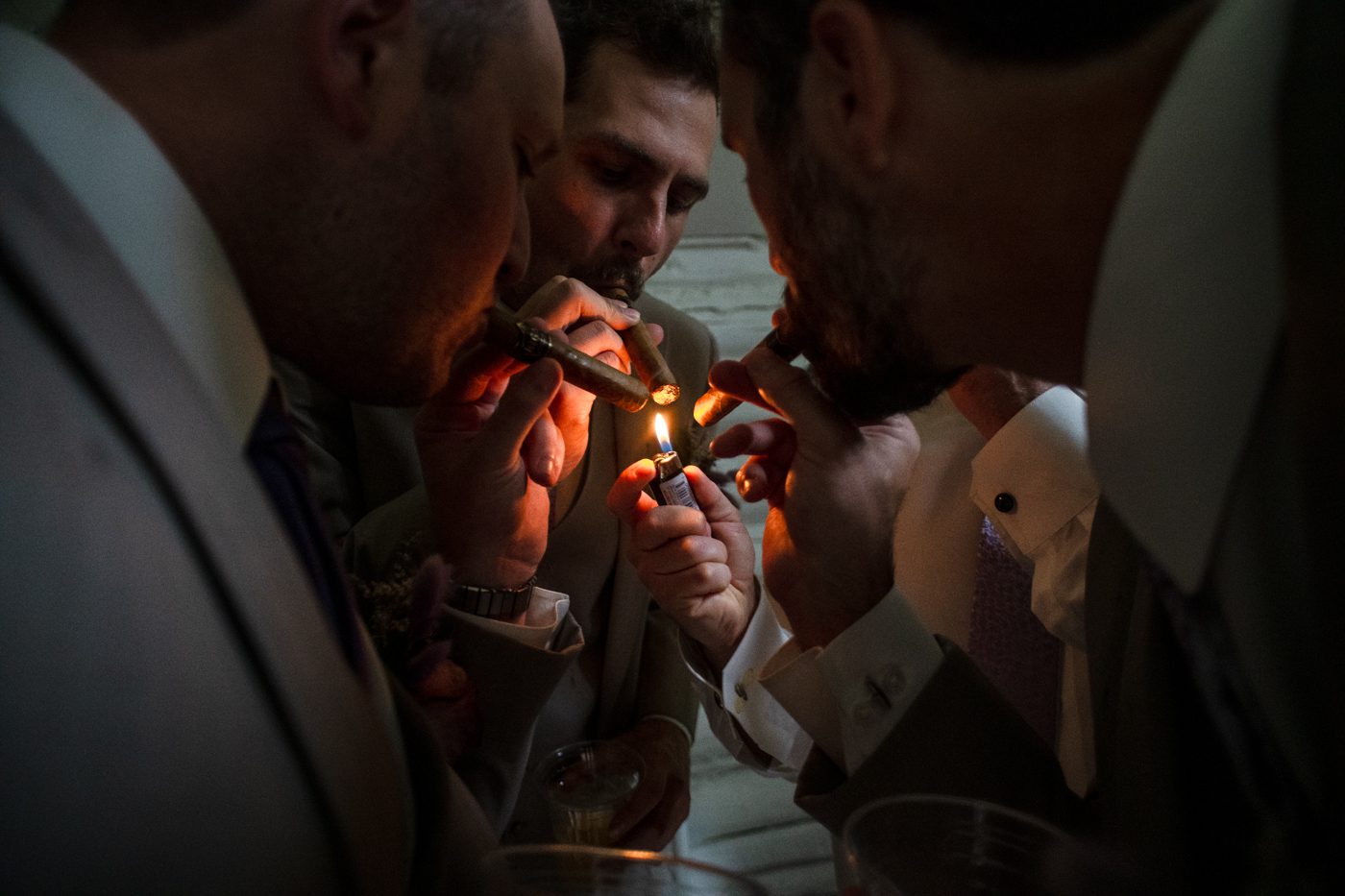 groomsment-light-cigars-in-celebration
