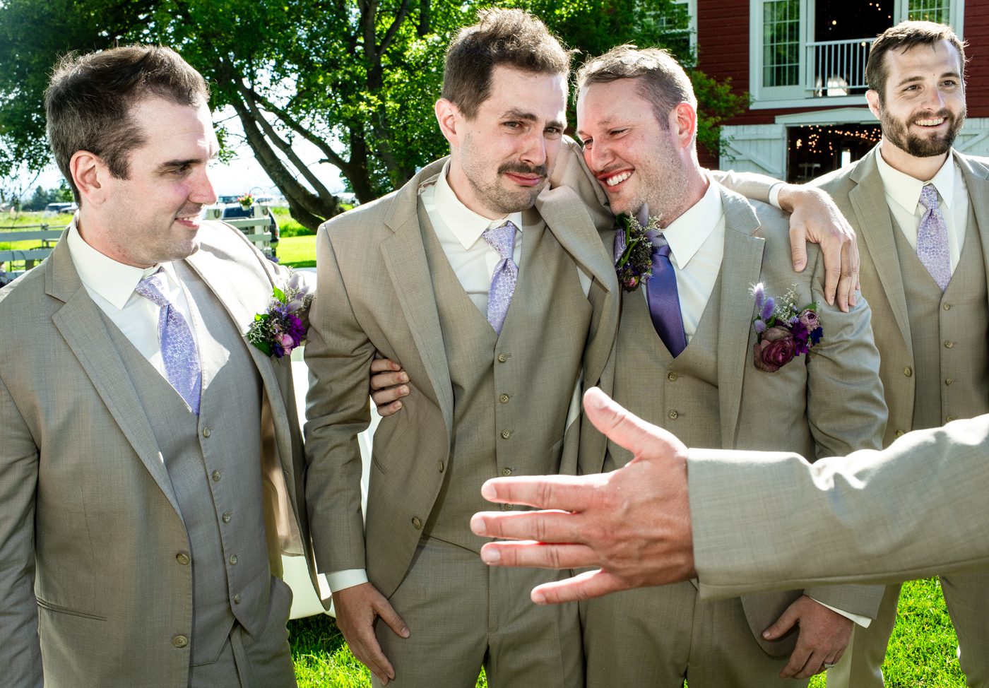 happy-tears-groomsman-hug-groom-at-roys-barn