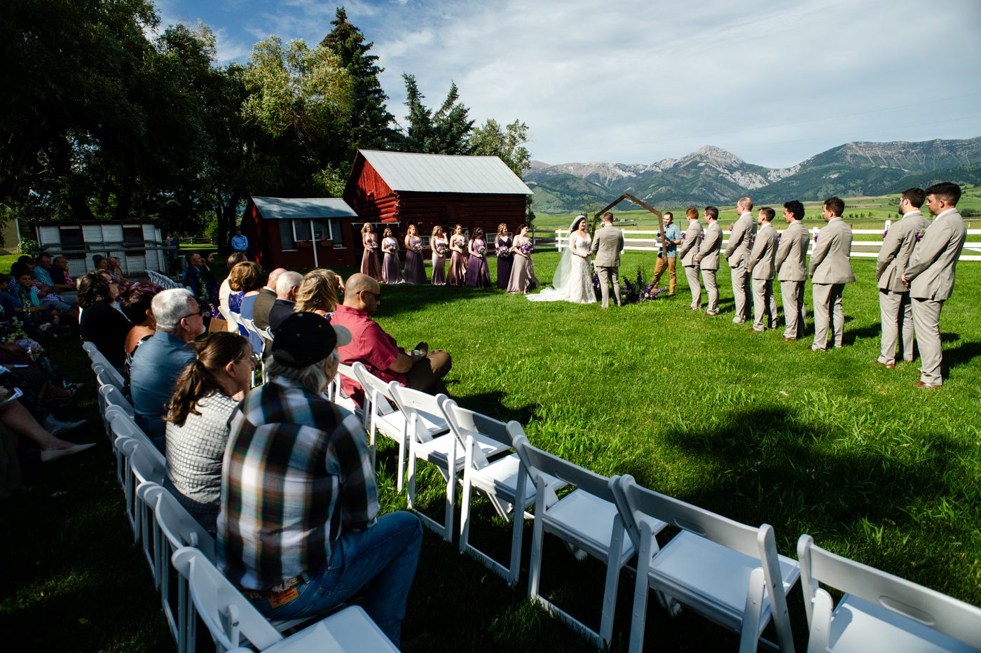 wedding-ceremony-under-bridger-mountains-at-roys-barn