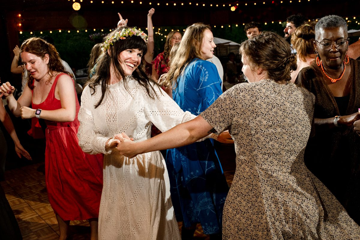 bride-dances-with-guests-at-Gallatin-River-Hideaway-wedding